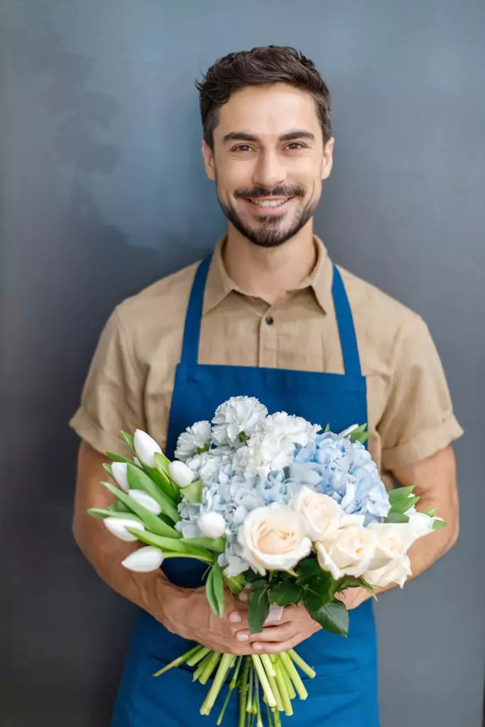 image of handsome florist with flowers